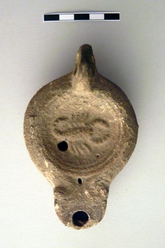 lucerna a volute, Loeschcke IV - ambito culturale romano (I-II secolo d.C.)